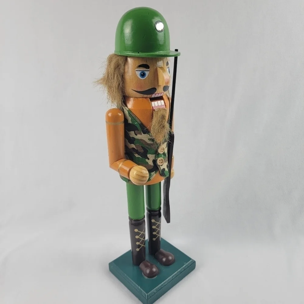 Wooden camouflage nutcracker with a rifle‎